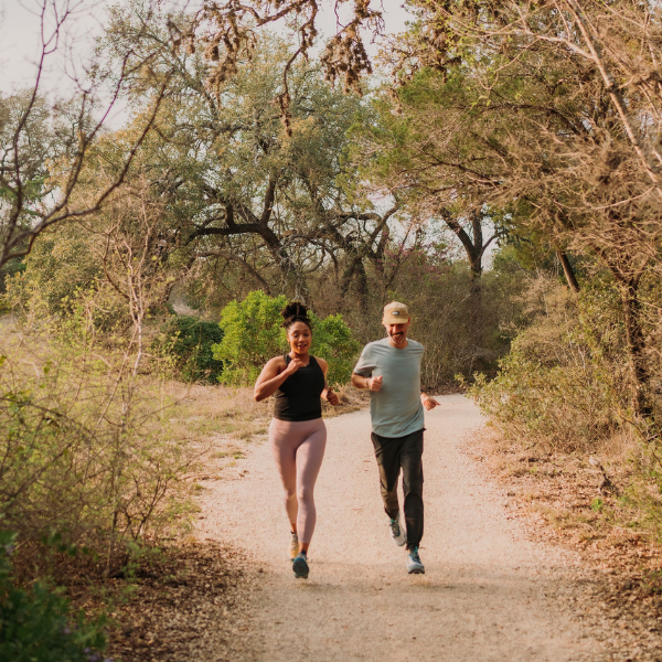 Two people running in vuori apparel