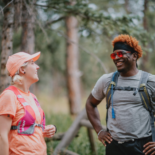 Man and Woman in Hydration Backpacks