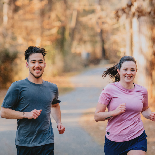 Man and Woman Running in Apparel