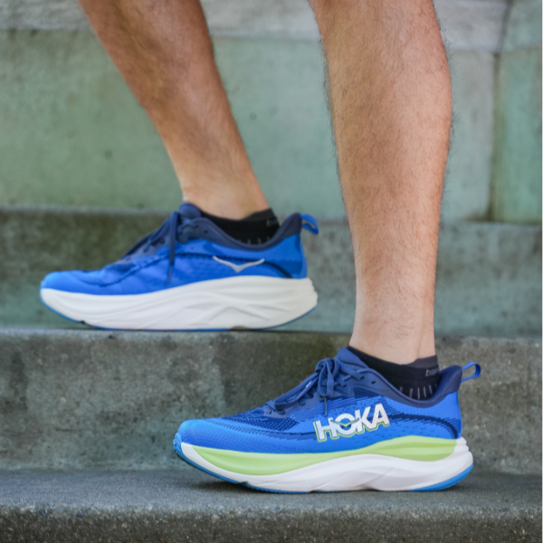 Man wearing HOKA Skyflow shoes