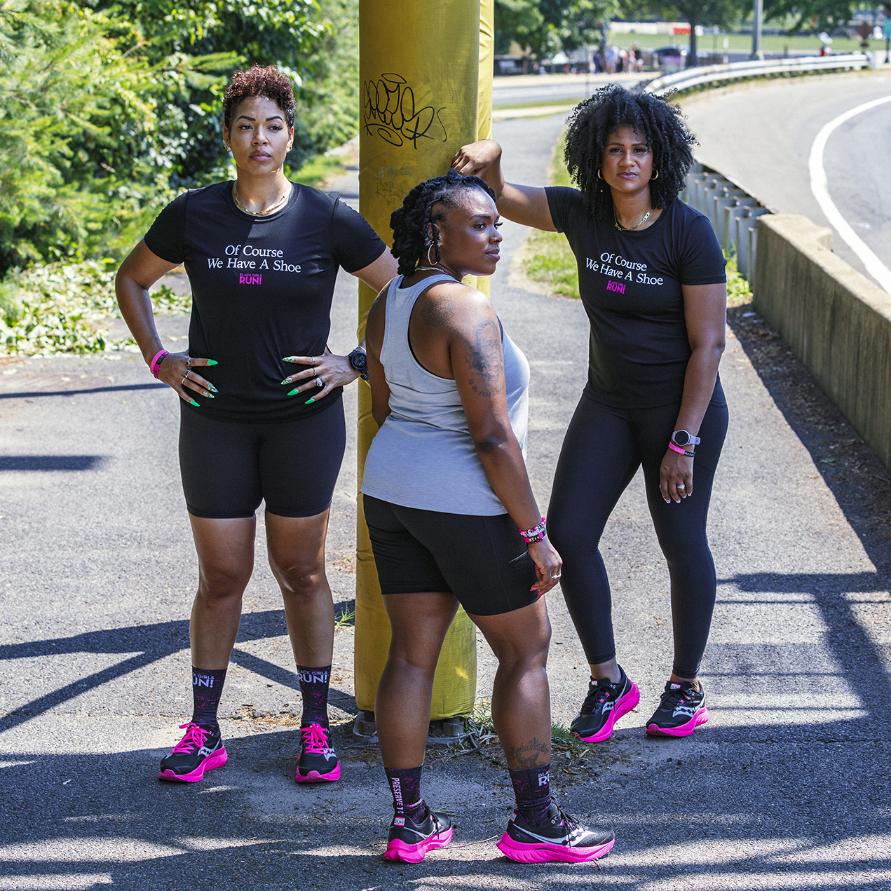 Three women wearing Black Girls Run! shirts and shoes