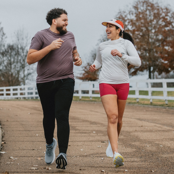 Man and woman wearing Saucony gear