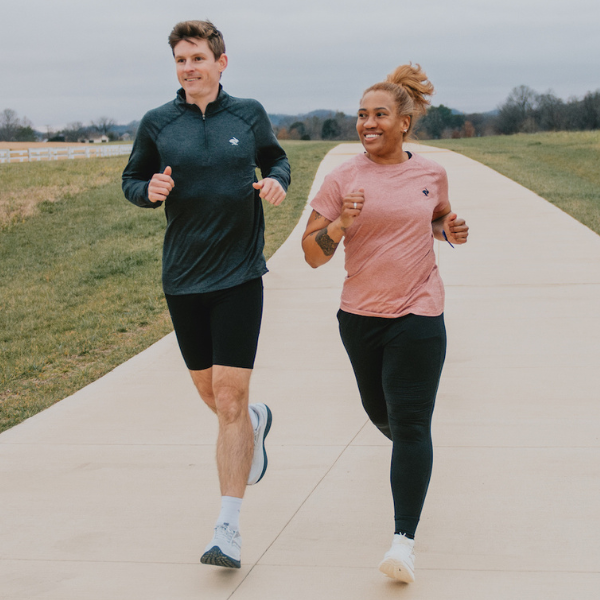 Man and woman wearing Saucony gear